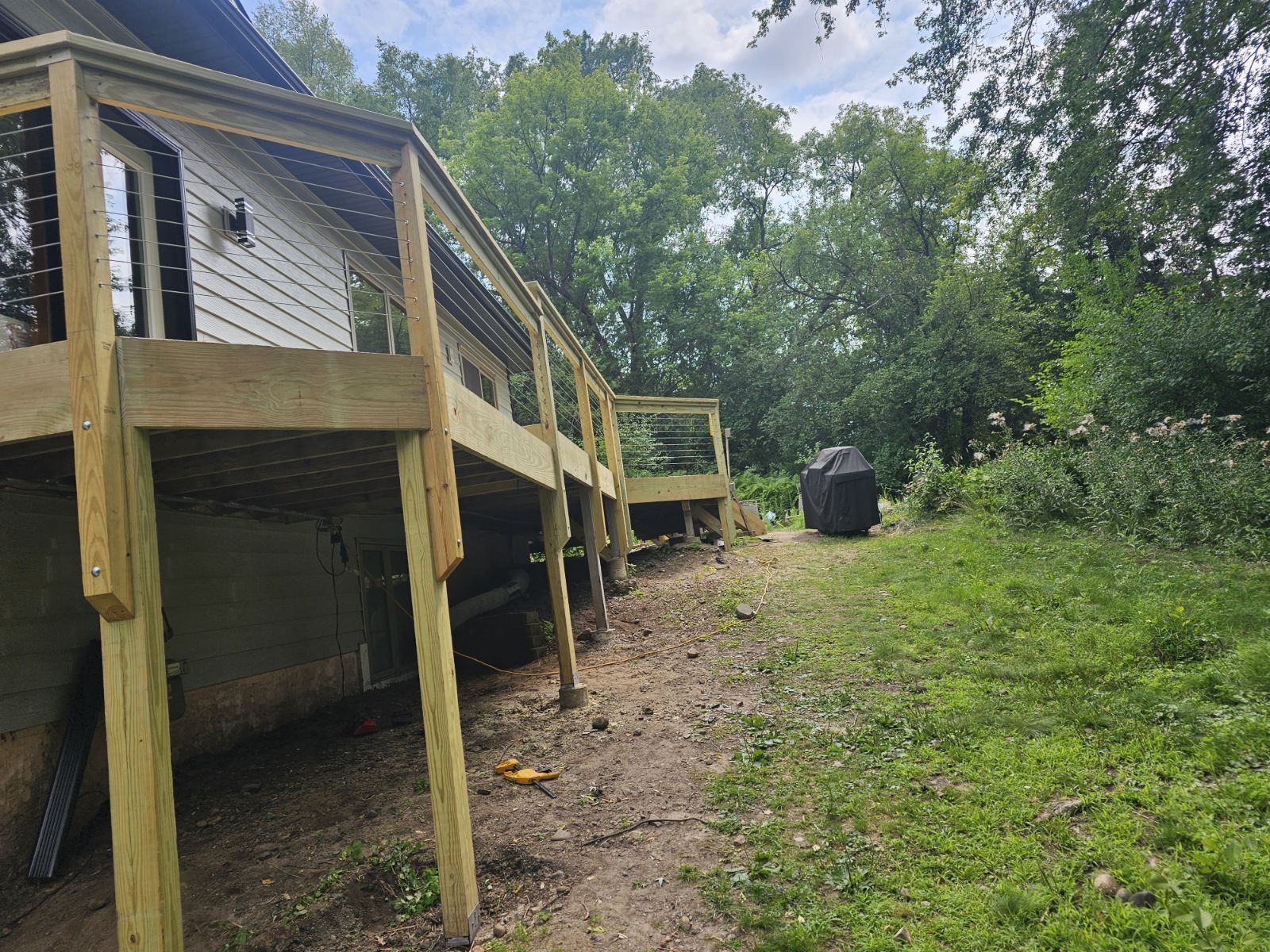 Elevated deck framing with cable railing